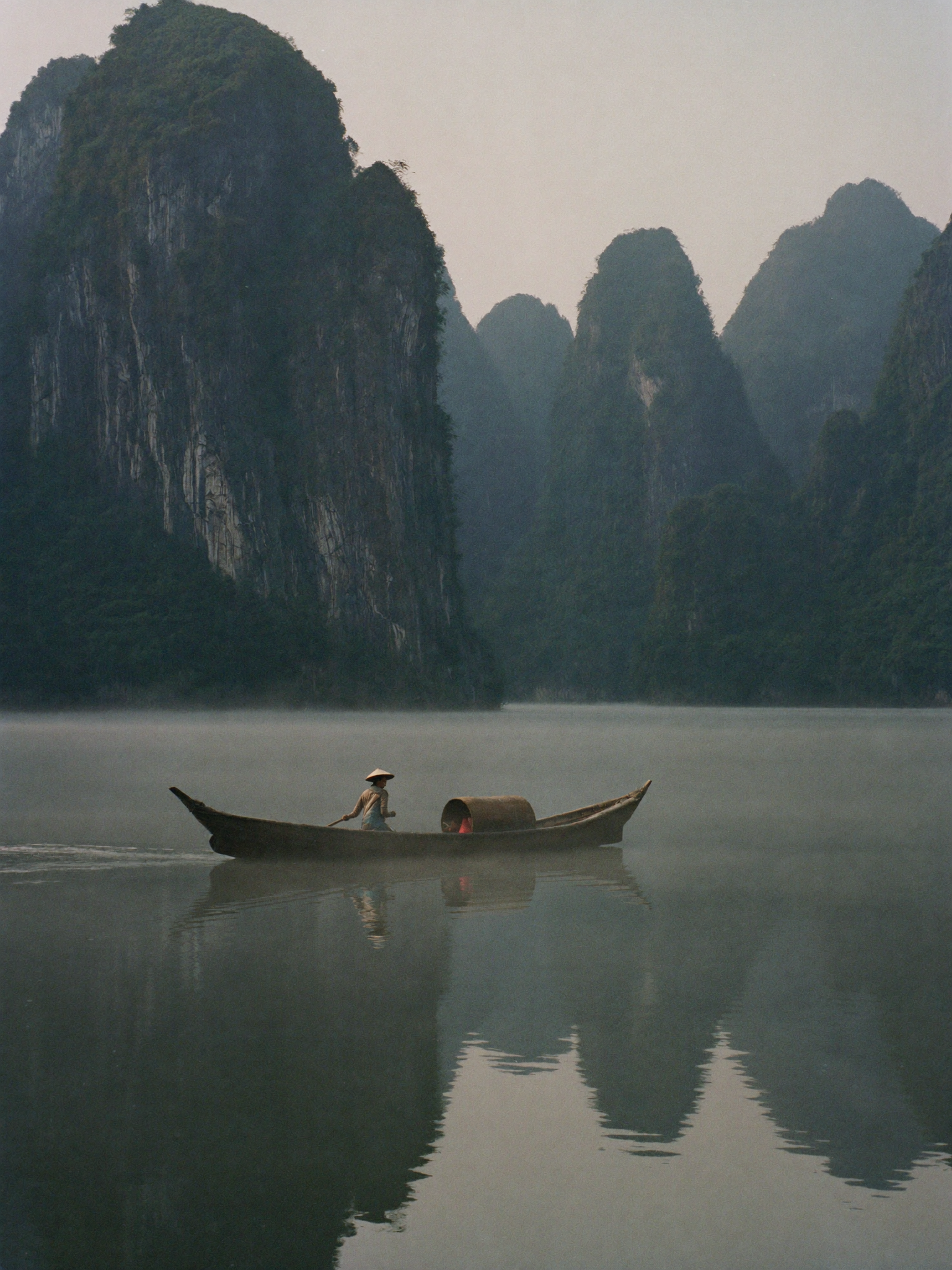 Illustrative concept of a small boat among Vietnam’s limestone landscapes